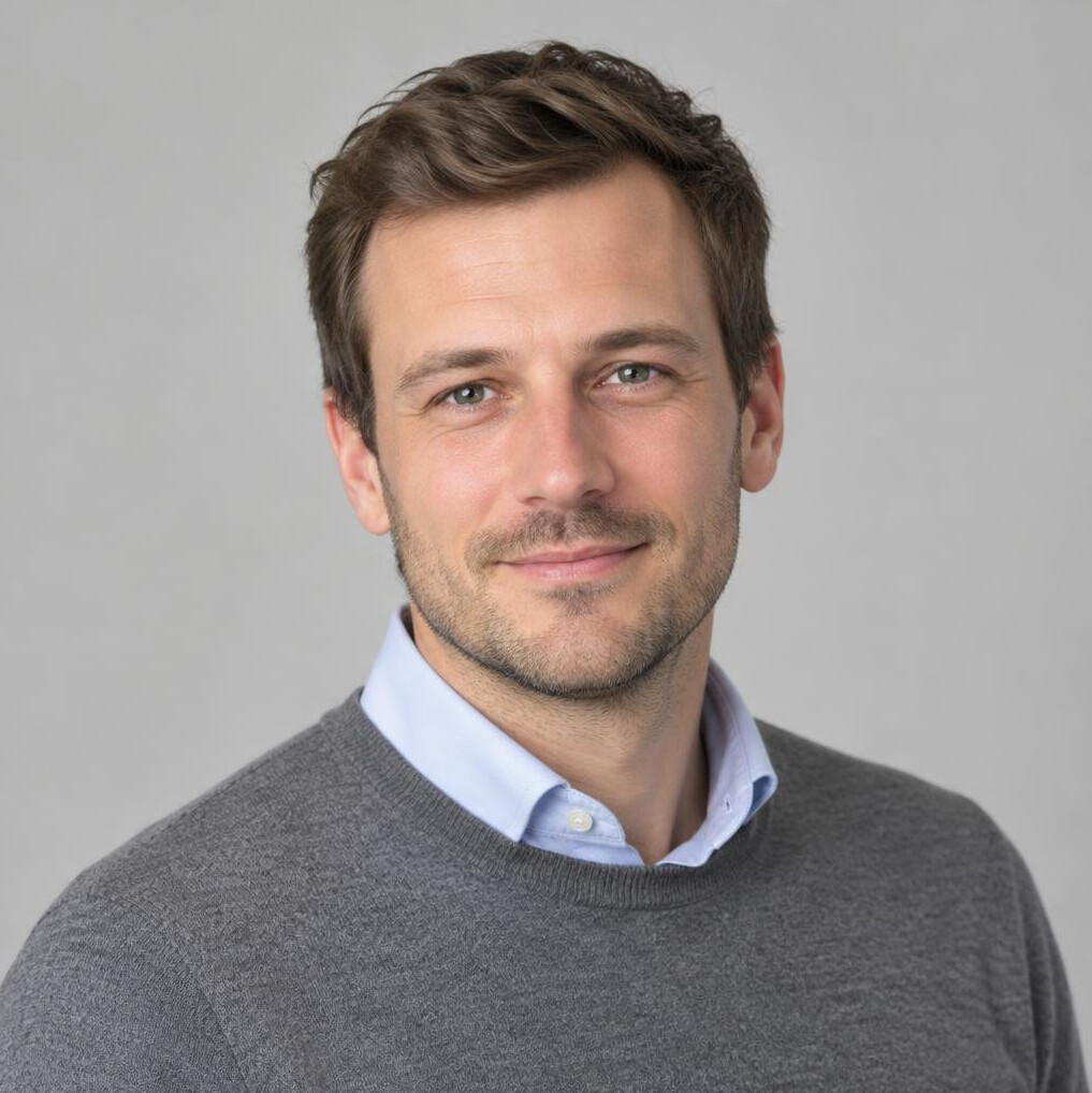 Portrait of a man with short hair and a beard